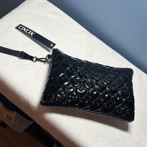 XOXO Shiny Black Heart-Patterned Clutch wristlet. NWT